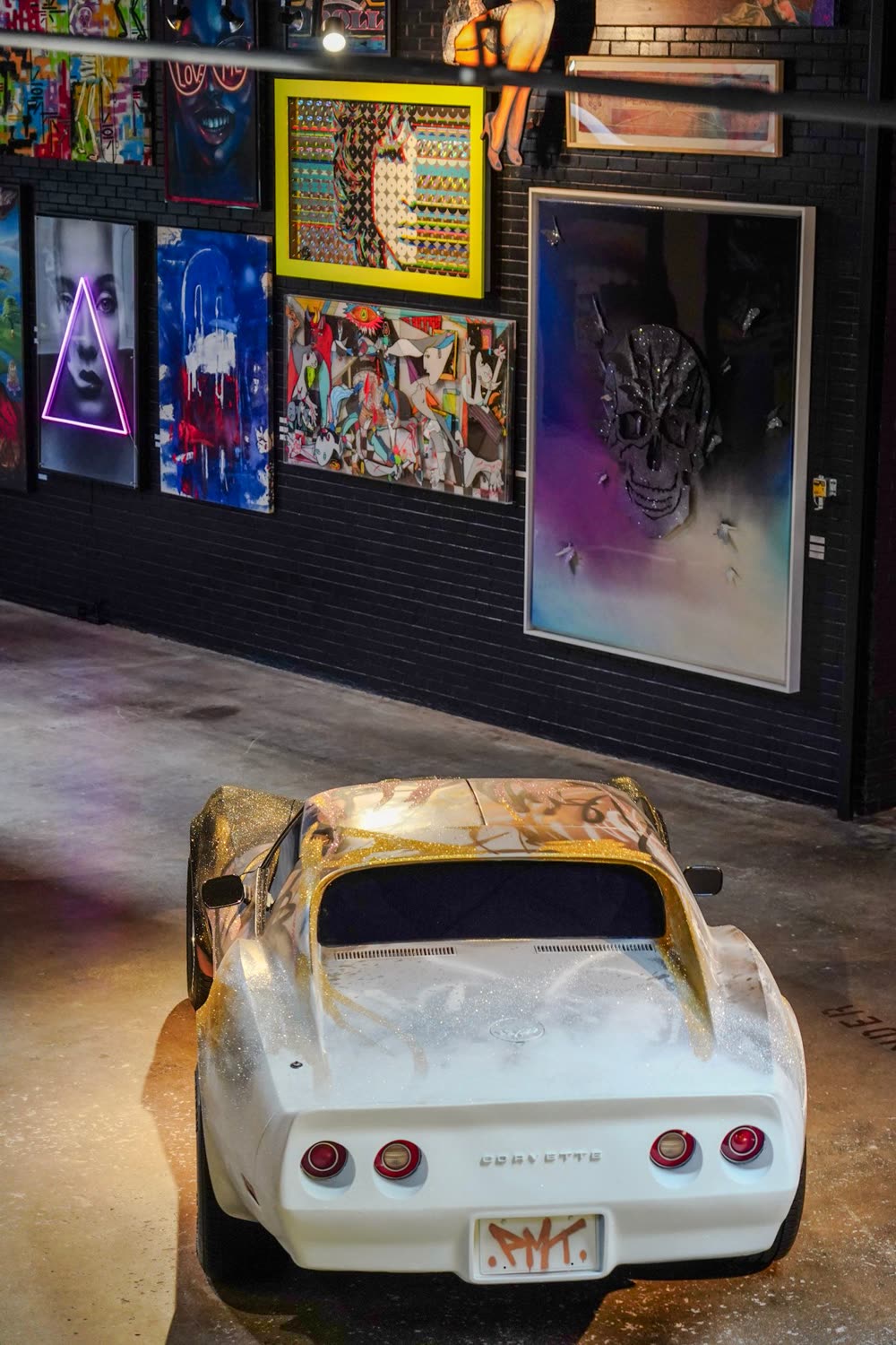 Gallery Defi interior — art car installation and gallery walls