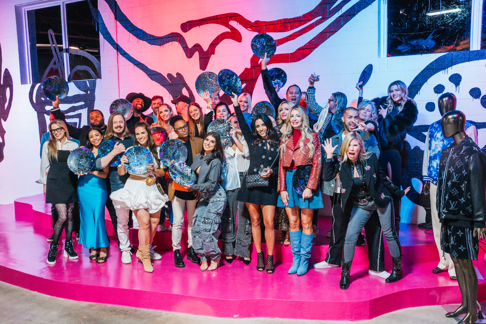 Corporate group posing on the Gallery Defi stage at a CTV Motion Club silent disco